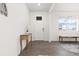 Bright foyer with hardwood floors, white walls, and a view of the neighborhood through the window at 3074 Belleville Ridge Rd, Elizabeth, CO 80107