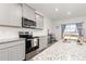 Modern kitchen featuring stainless steel appliances, gray cabinets, and plenty of counter space at 3074 Belleville Ridge Rd, Elizabeth, CO 80107