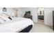 Well-lit bedroom featuring a TV, dresser, and access to the ensuite bathroom at 3074 Belleville Ridge Rd, Elizabeth, CO 80107