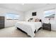 Bright and airy main bedroom with large windows offering scenic views and neutral décor at 3074 Belleville Ridge Rd, Elizabeth, CO 80107