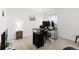 Office with plush carpet, neutral walls, and a modern black desk at 3074 Belleville Ridge Rd, Elizabeth, CO 80107