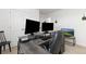 Office with a grey wooden desk and two computer monitors at 3074 Belleville Ridge Rd, Elizabeth, CO 80107