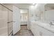 Bathroom with double vanity and a walk-in shower with glass doors at 39633 E 160Th Ave, Keenesburg, CO 80643