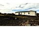 Exterior of a bright, one-story home with a large backyard and an open landscape at 39633 E 160Th Ave, Keenesburg, CO 80643