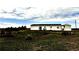 Exterior of a one story home with a large yard, open views, and cloudy sky at 39633 E 160Th Ave, Keenesburg, CO 80643