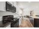 Well-equipped kitchen with modern appliances, sleek cabinetry, and an open layout connecting to the dining area at 39633 E 160Th Ave, Keenesburg, CO 80643
