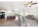Bright and spacious open-concept living area with a kitchen island and comfortable seating at 39633 E 160Th Ave, Keenesburg, CO 80643