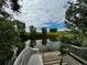 View from dock of pond featuring calming water and bench perfect for relaxation surrounded by trees and blue skies at 39633 E 160Th Ave, Keenesburg, CO 80643