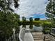 Beautiful view of a pond with benches, clear reflections, and surrounding greenery at 39633 E 160Th Ave, Keenesburg, CO 80643
