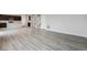 Spacious living room featuring hardwood floors that flow into the kitchen and staircase at 14434 Ranch St, Mead, CO 80504