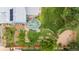 Aerial view of a private backyard featuring garden beds, seating, and mature landscaping at 21885 Whirlaway Ave, Parker, CO 80138