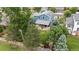 Aerial view showcases the home's well-maintained backyard, mature landscaping, and private setting at 21885 Whirlaway Ave, Parker, CO 80138