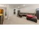 Finished basement area with neutral carpet and a comfortable seating area at 21885 Whirlaway Ave, Parker, CO 80138