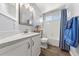 Clean bathroom with vanity, tub, and blue accents at 21885 Whirlaway Ave, Parker, CO 80138