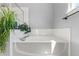 Relaxing bathtub with tile surround and greenery at 21885 Whirlaway Ave, Parker, CO 80138