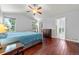 Spacious main bedroom with vaulted ceiling, gleaming hardwood floors, and ensuite bath access at 21885 Whirlaway Ave, Parker, CO 80138