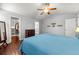 Spacious main bedroom with vaulted ceiling, gleaming hardwood floors, and ensuite bath access at 21885 Whirlaway Ave, Parker, CO 80138