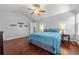 Spacious main bedroom with vaulted ceiling, gleaming hardwood floors, and ensuite bath access at 21885 Whirlaway Ave, Parker, CO 80138