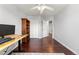 Bright office with dark wood floors and natural light at 21885 Whirlaway Ave, Parker, CO 80138