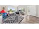 Bright playroom with large windows, laminate floors, toys, and a cozy reading nook at 21885 Whirlaway Ave, Parker, CO 80138
