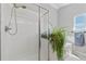 Shower with tile surround and glass door at 21885 Whirlaway Ave, Parker, CO 80138