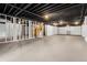 Unfinished basement with exposed ceiling, ductwork, and painted floors, ready for customization at 9303 Dauntless Way, Conifer, CO 80433