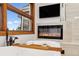 Elegant soaking tub features a mounted tv and a fireplace, offering a spa-like experience in the comfort of your home at 9303 Dauntless Way, Conifer, CO 80433