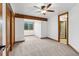 Inviting bedroom boasts backyard view window, a ceiling fan, and carpeted floors at 9303 Dauntless Way, Conifer, CO 80433