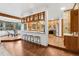 Breakfast nook filled with natural light and access to the outdoor patio and wooded view at 9303 Dauntless Way, Conifer, CO 80433