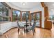 Charming breakfast nook with wooded views and a door to the outdoors at 9303 Dauntless Way, Conifer, CO 80433