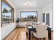 Inviting dining room with large windows, hardwood floors, and contemporary decor at 9303 Dauntless Way, Conifer, CO 80433