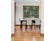 Elegant dining area features hardwood floors and a window with serene views at 9303 Dauntless Way, Conifer, CO 80433