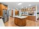 Spacious kitchen with stainless steel appliances and a large center island with white countertop at 9303 Dauntless Way, Conifer, CO 80433