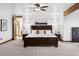 Bright main bedroom featuring a ceiling fan, and and nightstands at 9303 Dauntless Way, Conifer, CO 80433