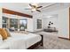 Large main bedroom featuring a beamed ceiling, and a sitting area with wooded views at 9303 Dauntless Way, Conifer, CO 80433