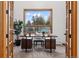 Bright home office with large window offering serene views and a modern workspace at 9303 Dauntless Way, Conifer, CO 80433