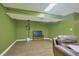 Green basement wall with a bench and a small storage area at 983 S Ouray St, Aurora, CO 80017