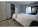 Bedroom with closet and dark wood mirror and dresser at 983 S Ouray St, Aurora, CO 80017