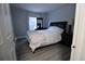 Bedroom with neutral gray walls and wood floors at 983 S Ouray St, Aurora, CO 80017