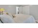 Bedroom featuring a bed with fluffy pillows and a view of the closet through the open door at 983 S Ouray St, Aurora, CO 80017