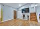 Inviting entryway with wood flooring, a storage closet, and staircase leading to the upper level at 983 S Ouray St, Aurora, CO 80017