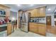 Spacious kitchen featuring stainless steel refrigerator and ample counter space at 983 S Ouray St, Aurora, CO 80017