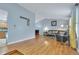 Open living room featuring vaulted ceiling and hardwood floors, with access to the kitchen at 983 S Ouray St, Aurora, CO 80017