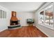 Bright living room featuring hardwood floors and a fireplace at 2918 S Ouray Way, Aurora, CO 80013