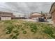 Spacious backyard featuring patio with furniture, shed, and a partial lawn at 10948 Murray Dr, Northglenn, CO 80233