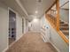 Basement hallway with carpet, storage, and access to other areas of the home at 10948 Murray Dr, Northglenn, CO 80233