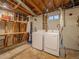 The unfinished basement with laundry hookups and storage space at 10948 Murray Dr, Northglenn, CO 80233