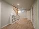 Spacious basement with neutral walls, carpet, staircase, storage, and ample room at 10948 Murray Dr, Northglenn, CO 80233