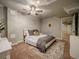 Cozy bedroom with a ceiling fan, plush carpet, and comfortable queen size bed at 10948 Murray Dr, Northglenn, CO 80233