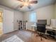 Cozy bedroom featuring neutral walls, carpet, ceiling fan, and a workstation area at 10948 Murray Dr, Northglenn, CO 80233